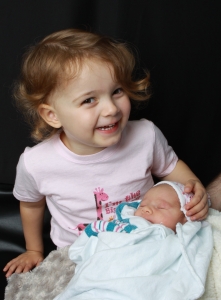 A happy big sister, right from the beginning